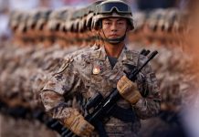 Japan rejects ‘new militarism’, accuses China of rapidly arming